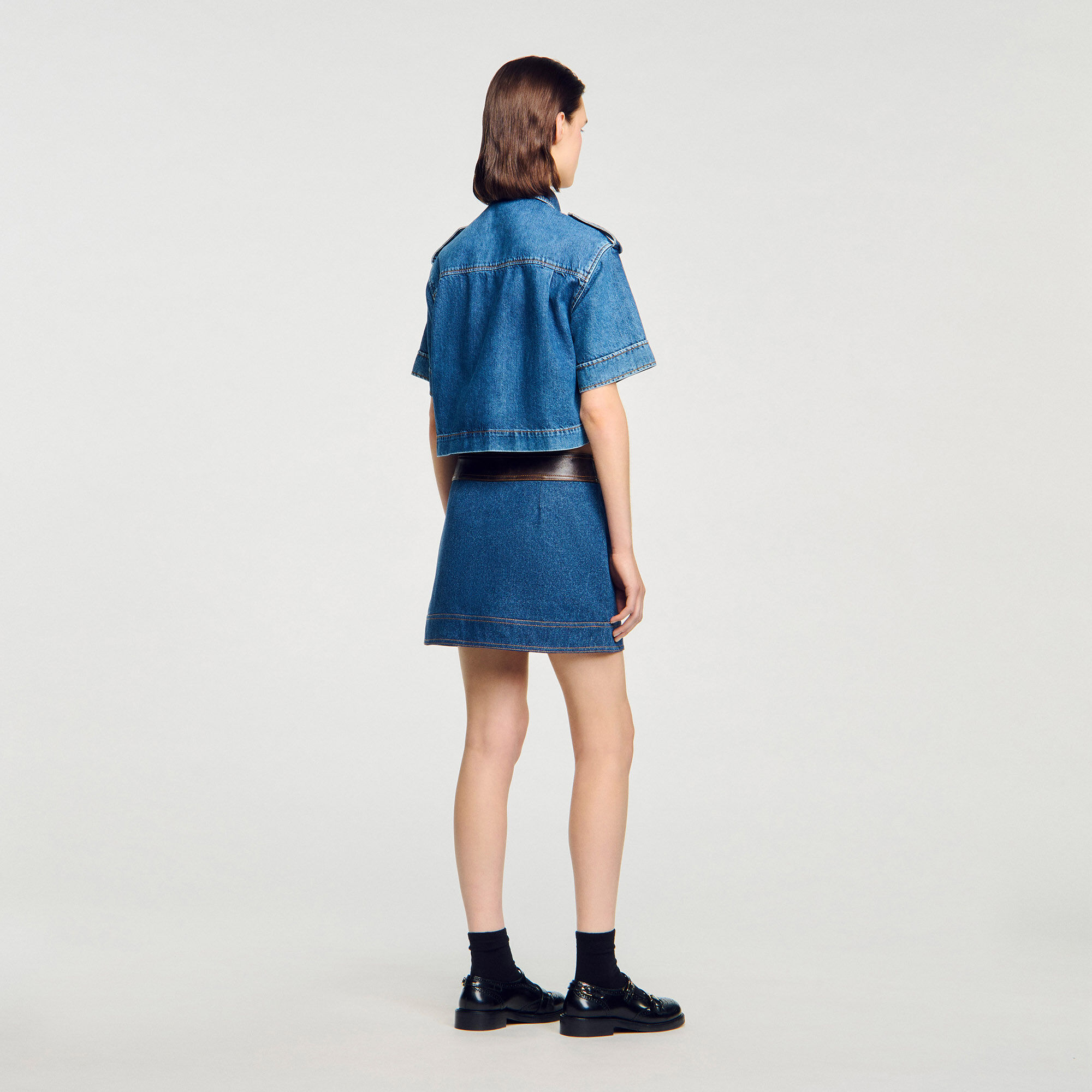 Mini denim and leather skirt