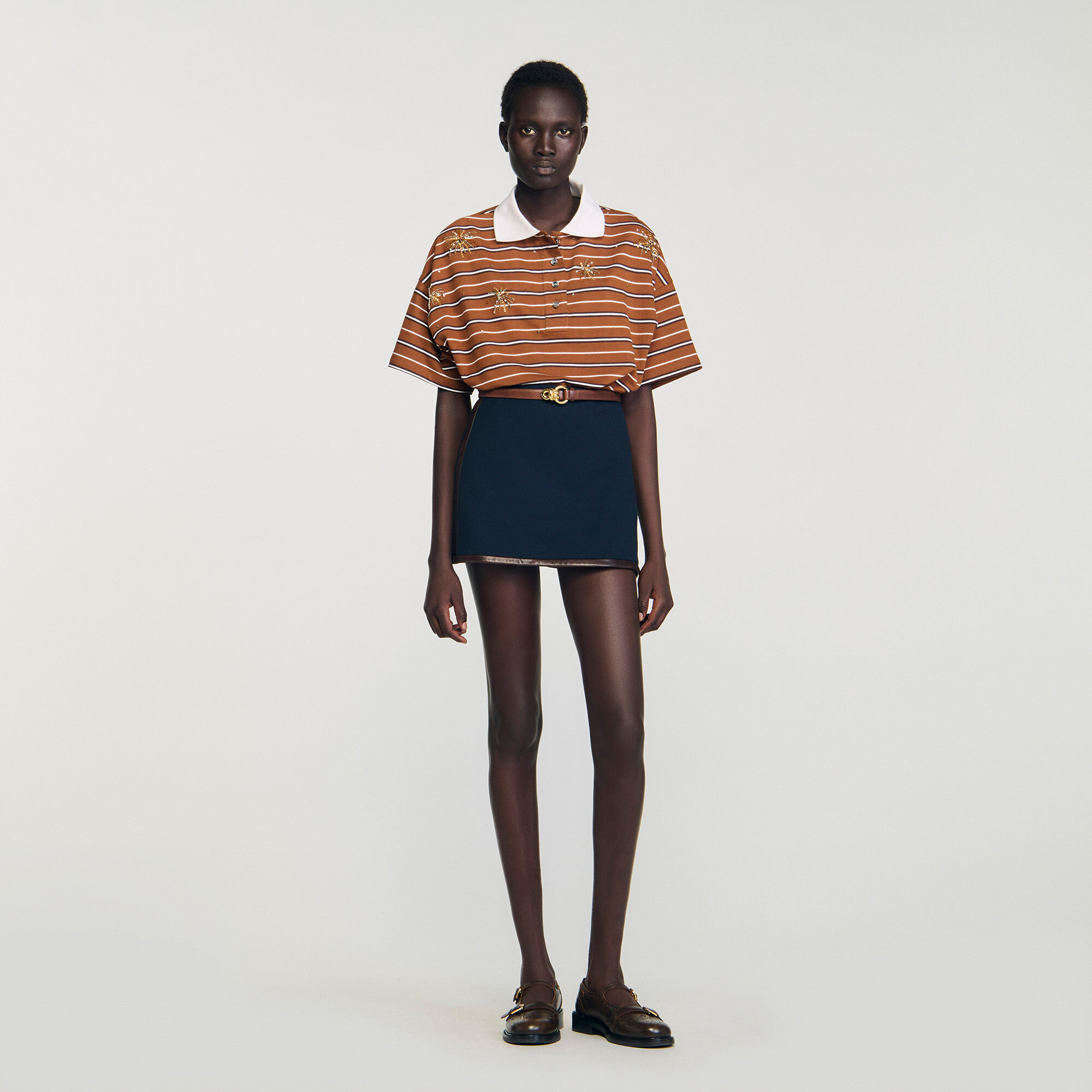 Mini skirt with leather bands